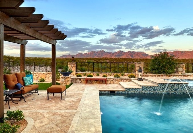 Mid-sized southwestern backyard fountain design with a rectangular natural pool