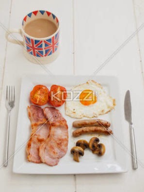 Cooked English Breakfast With Cup Of Tea